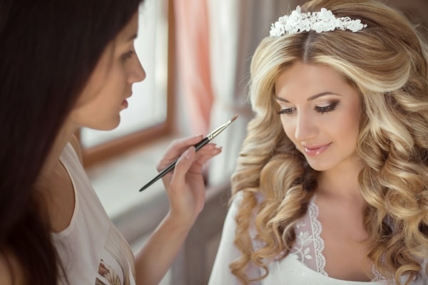Bride doing makeup